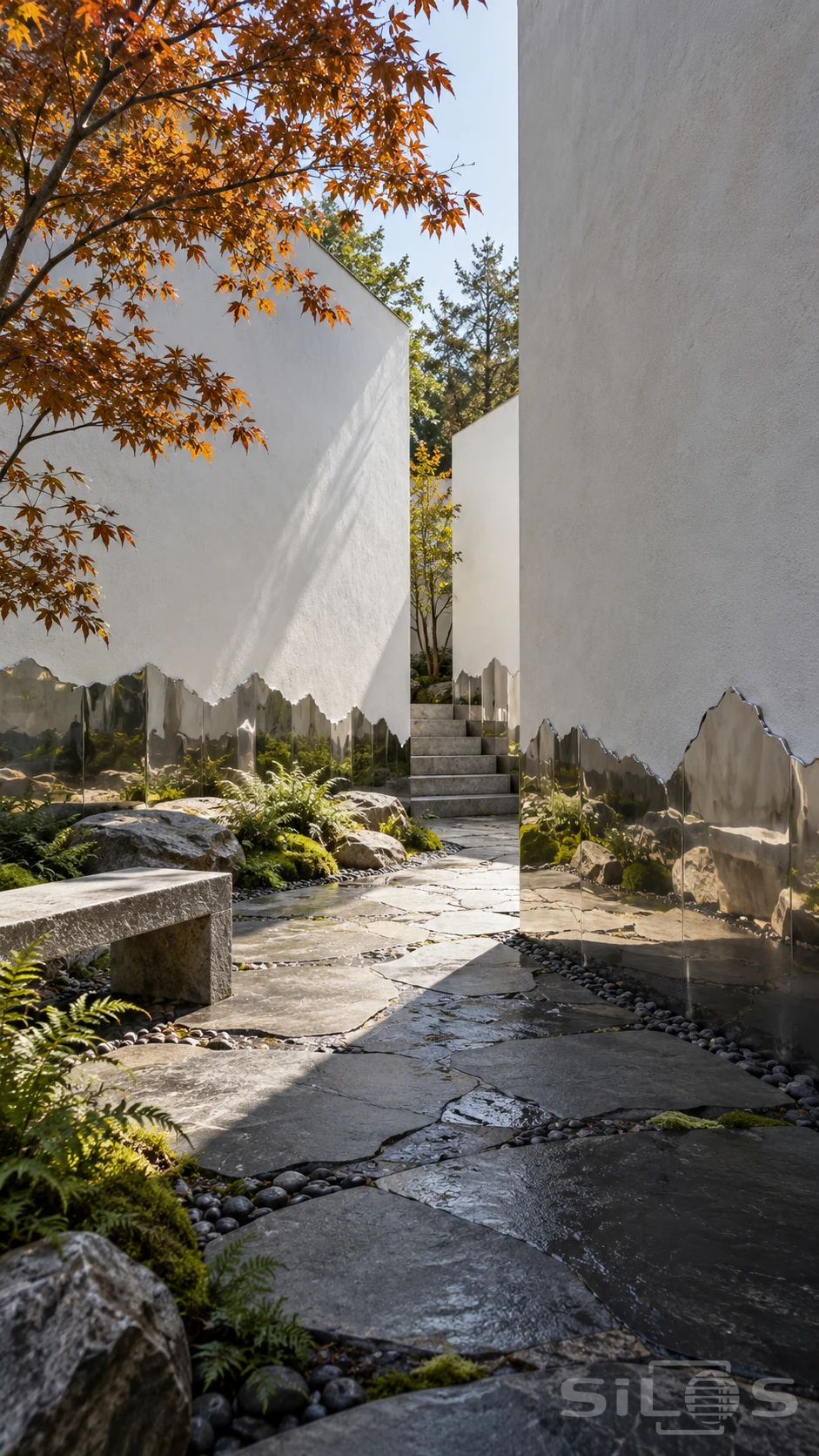 Tall white courtyard walls have jagged mirror-polished bases reflecting moss and stones beside a winding slate path.