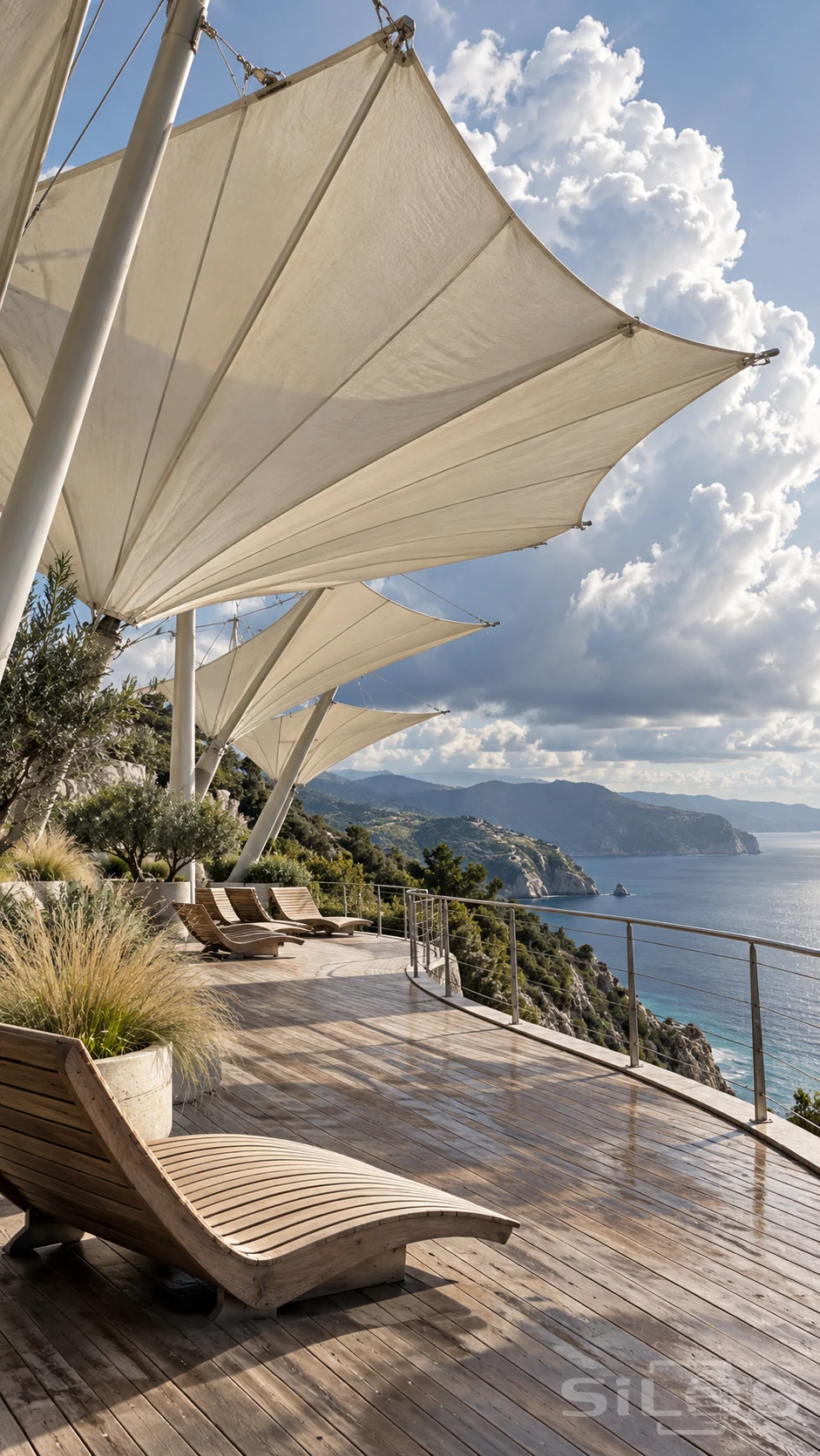 Huge ivory folded coastal shades cover timber loungers on a cliffside cloud-watching terrace above blue water and distant headlands.