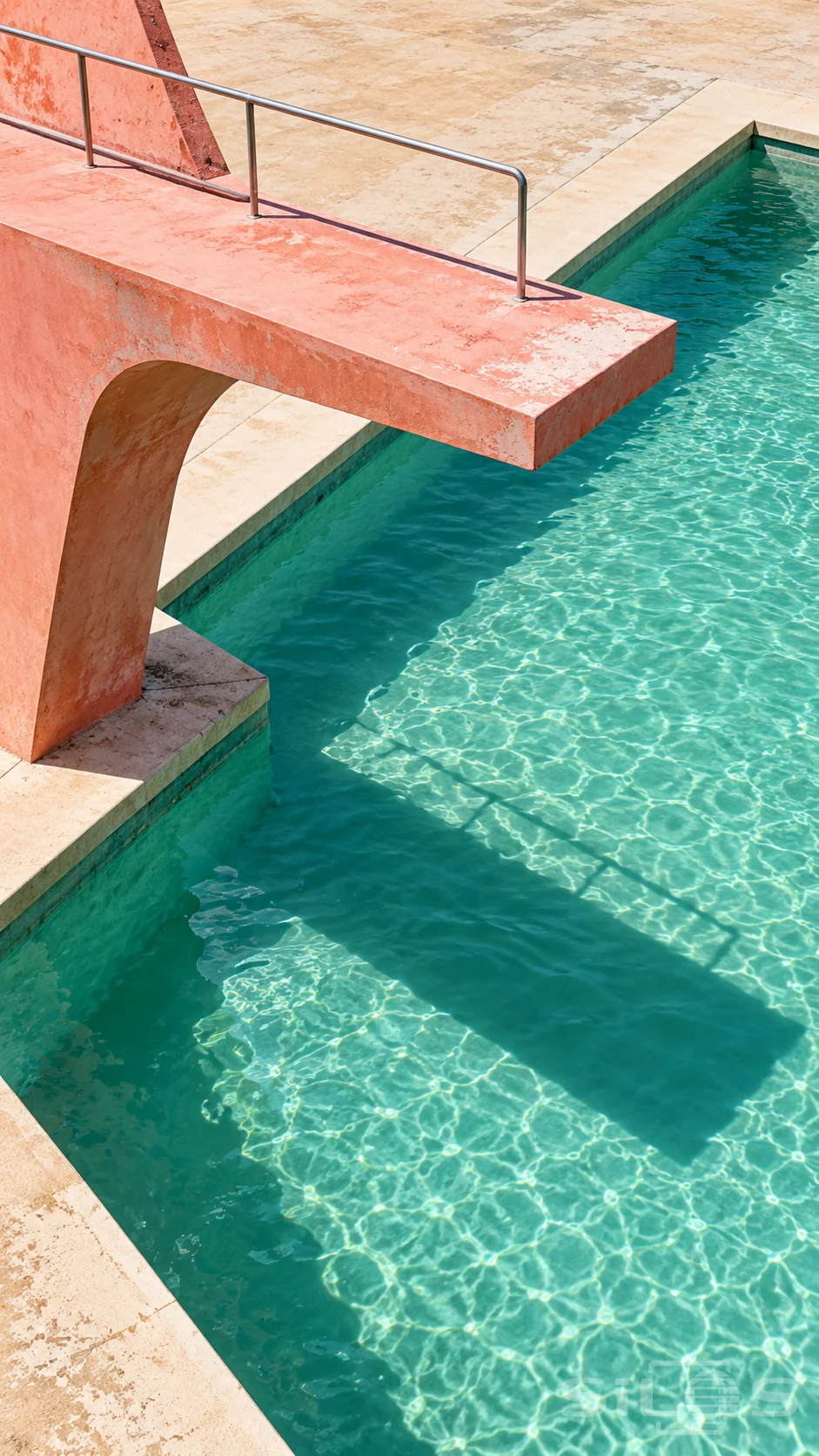 A coral-pink concrete diving platform with a silver rail extends over clear mint-green pool water with bright caustics and a strong shadow.