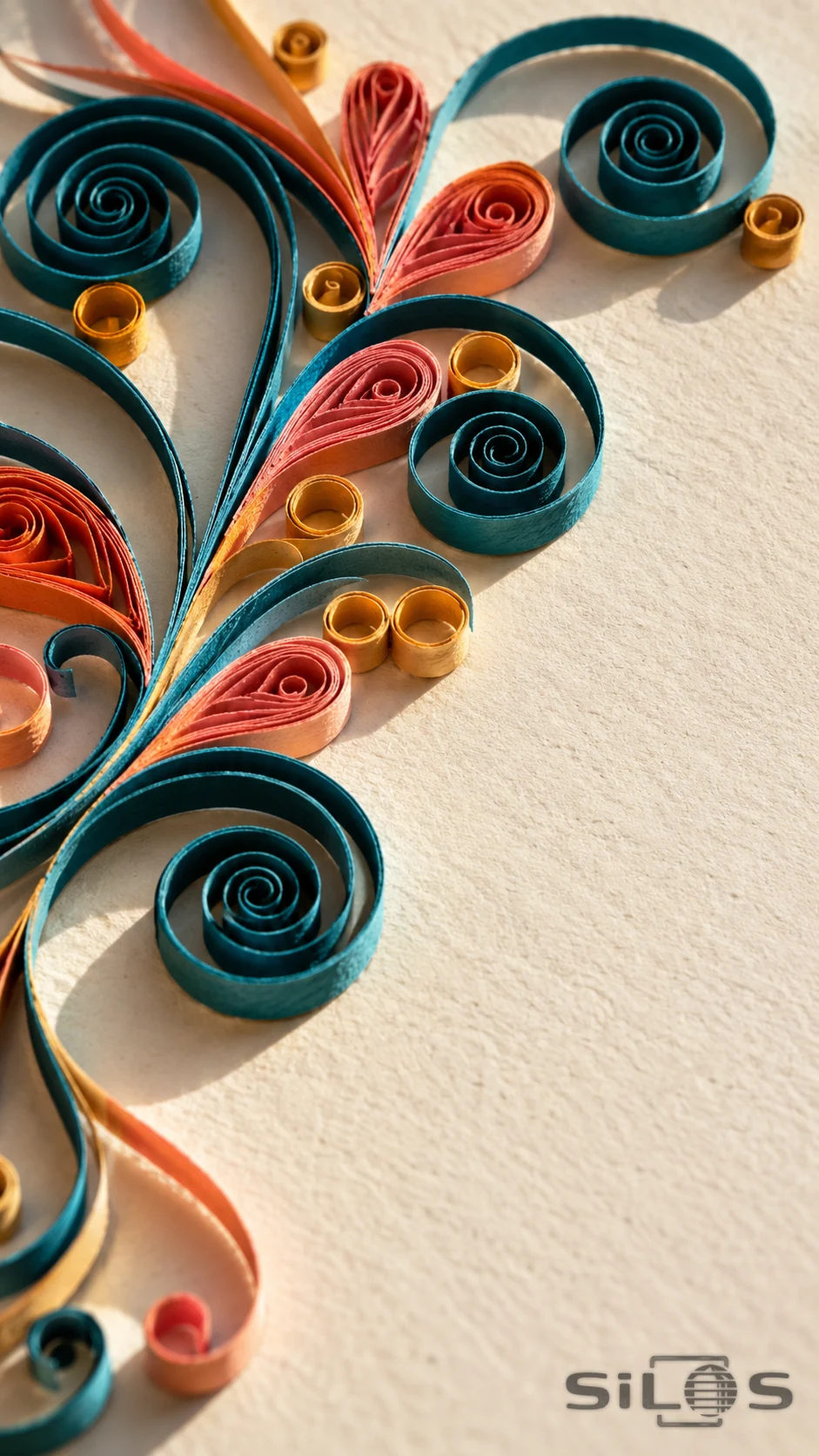 Handmade teal and coral quilled paper spirals with ochre loops on textured ivory card.